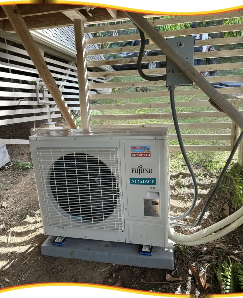 Kung Fu Air Service AC unit installed under a home