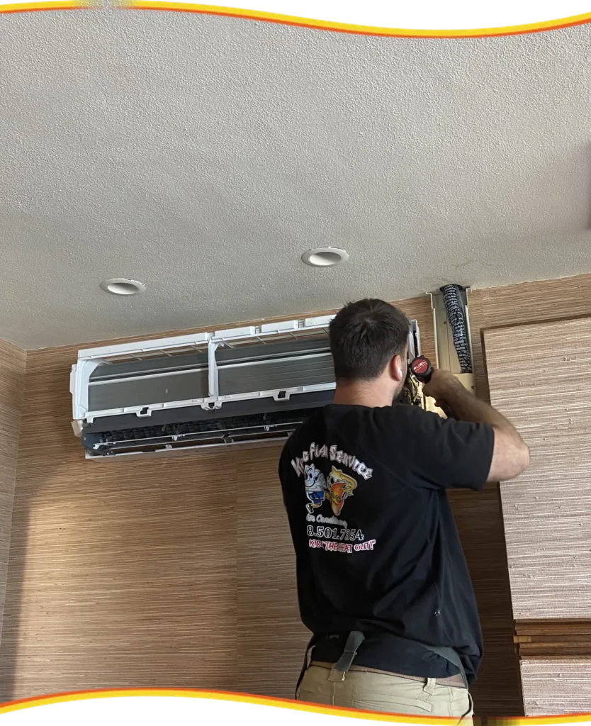 Kung Fu Air Service technician servicing a wall-mounted mini-split