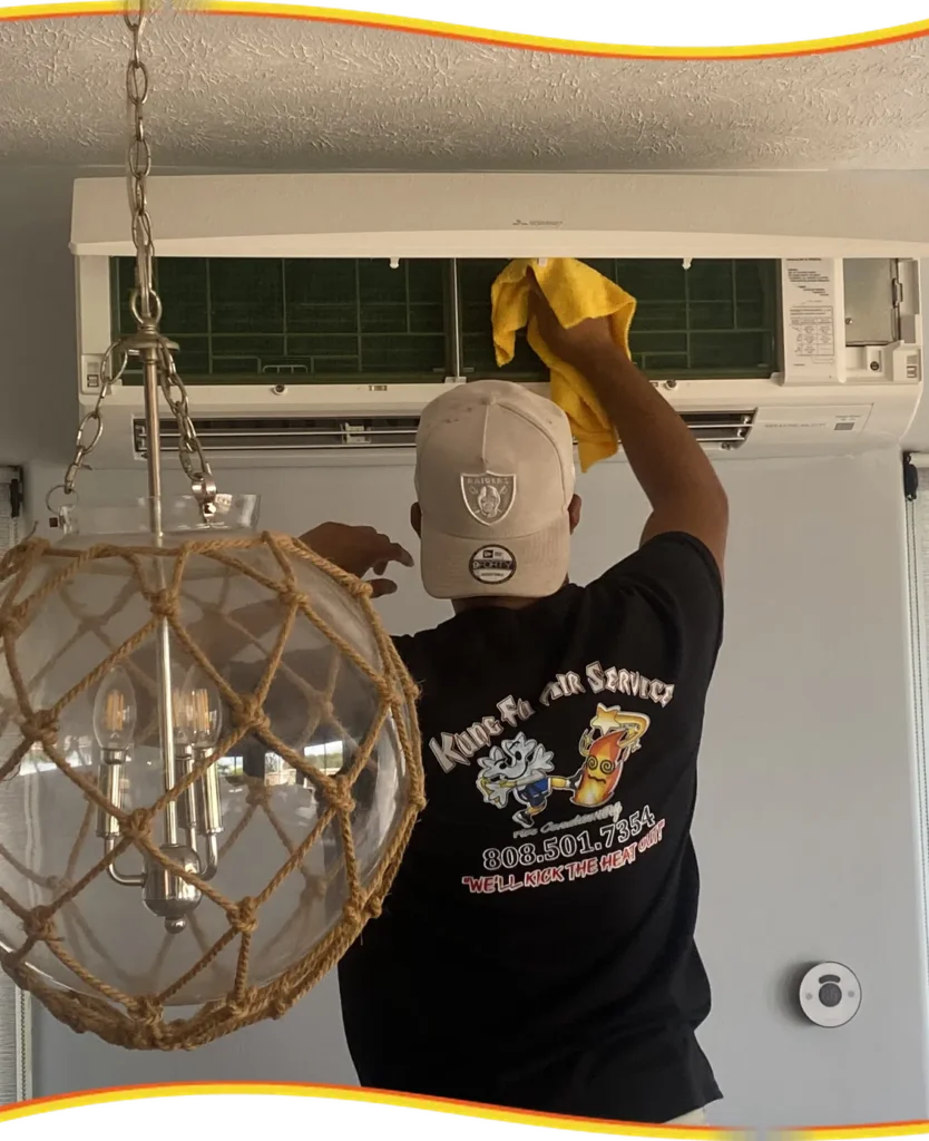 Kung Fu Air Service technician cleaning a wall-mounted mini-split unit